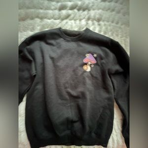 black crewneck with trippy mushroom design